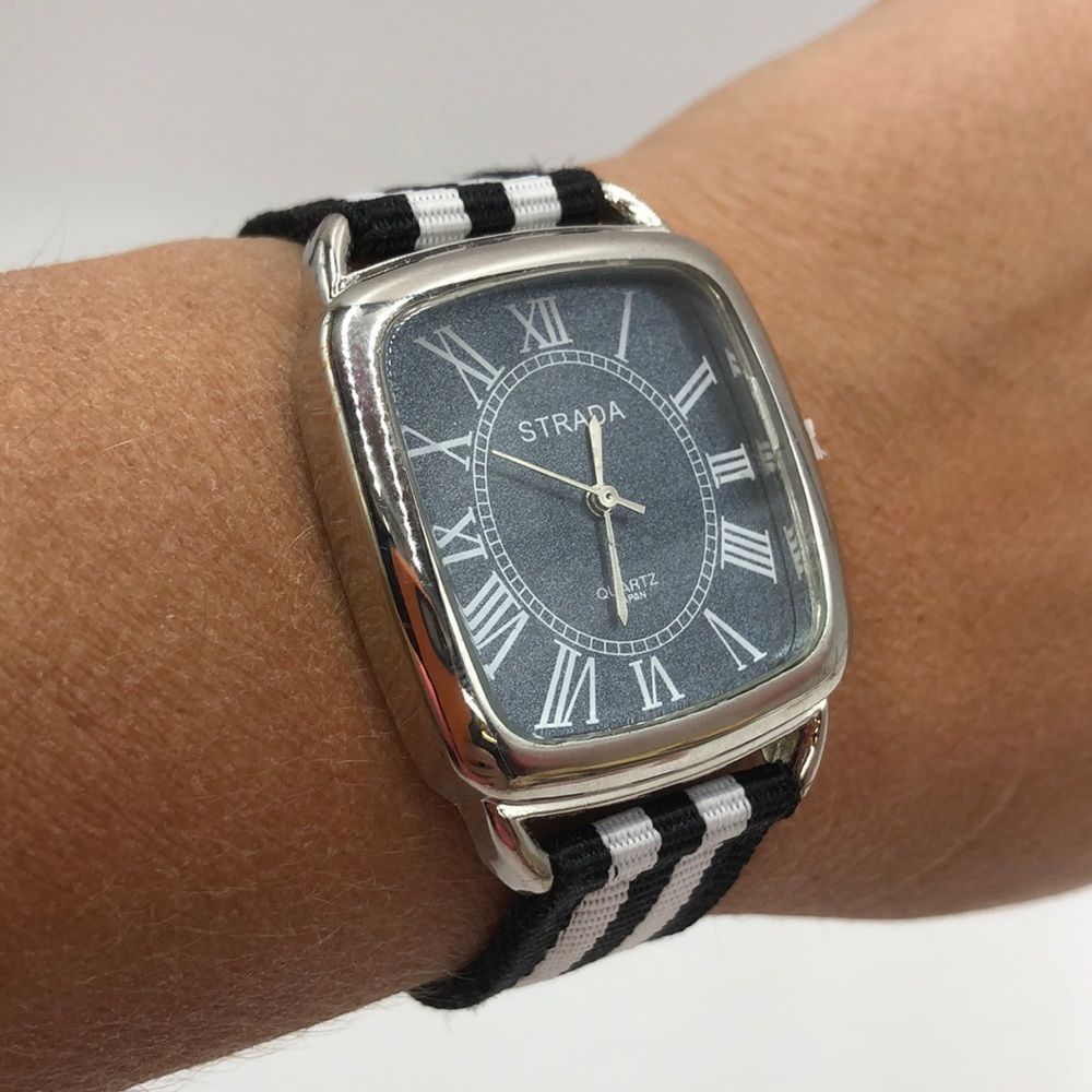 Black/White striped Strada wristwatch with silver framed clock face and hardware